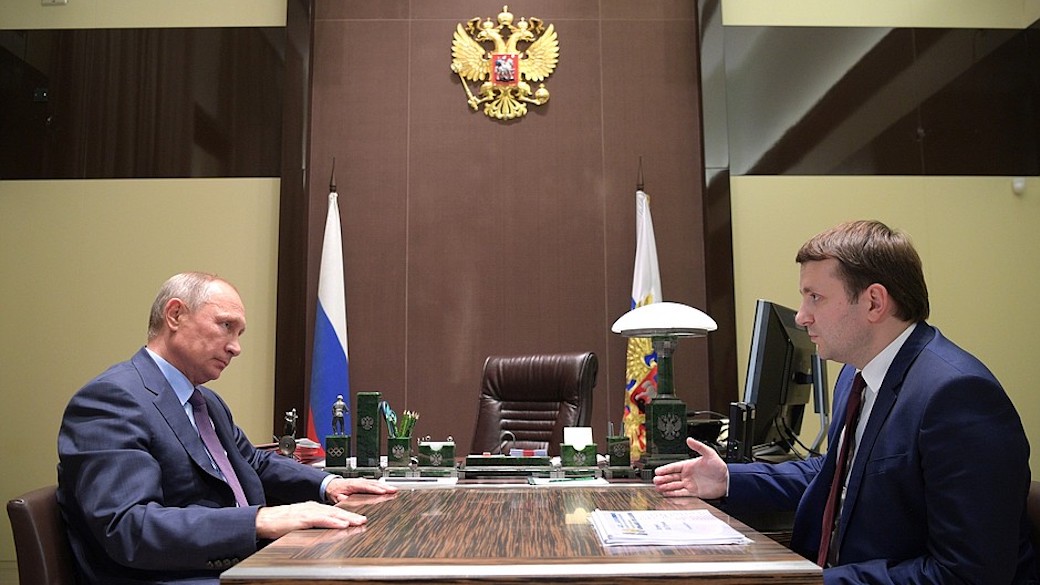 Russlands Präsident Wladimir Putin und Wirtschaftsminister Maxim Oreschkin